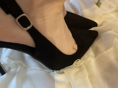 feet in black high heels
