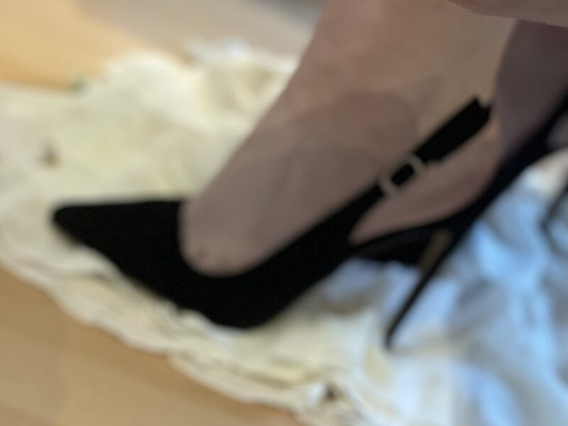 feet in black high heels
